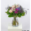 Eleganter Blumenstrauß mit pastellfarbenen Rosen, Orchideen, lila Hortensie und zartem Schleierkraut, kombiniert mit frischem Grün – ein stilvoller Hingucker für jede Gelegenheit