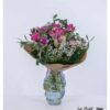 Blumenstrauß mit Amaryllis, Rosen, Freesien, Schleierkraut, Olivenzweigen und Aralienblättern – liebevoll arrangiert und ideal für besondere Anlässe oder als stilvoller Blickfang.