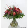 Strauß mit pfirsichfarbenen Rosen und Celosia