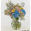Großer Blumenstrauß in Pastell mit blauen Hortensien, gelben Gerbera, rosa Rosen und Rittersporn